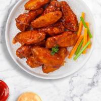Bold With Buffalo Wings · Fresh chicken wings fried until golden brown, and tossed in buffalo sauce. Served with a sid...