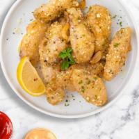 Poultry Parm Wings · Fresh chicken wings fried until golden brown, and tossed in garlic and parmesan. Served with...