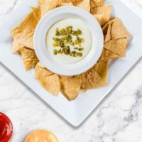 Chips & Queso · Plain chips with queso dip on the side.