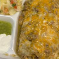 Smothered Burrito · Burrito filled with rice, beans and your choice of protein. topped with green sauce and chee...