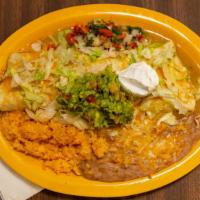 Carne Asada Burrito · Delicious carne asada burrito smothered in either red or green salsa. Topped with lettuce, o...