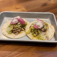 Chicken Street Tacos · Honey lime slaw, pickled red onion, cotija cheese, flour tortilla.
