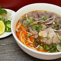Hs7-Spicy Beef Noodle Soup (Bun Bo Hue) · Central Vietnam Hue Spicy Beef Noodle Soup with beef shank and pork hock, served with bean s...