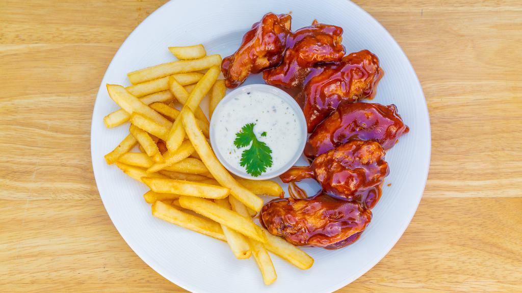 Chicken Wings · Your choice of buffalo, BBQ, or Mango/Habanero sauce served with fries.
