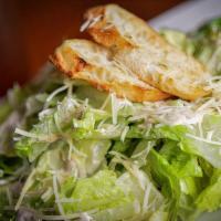 Caesar Salad Small (Serves 10-15)  · Romaine lettuce tossed with our homemade Caesar dressing and served with Parmesan and crosti...