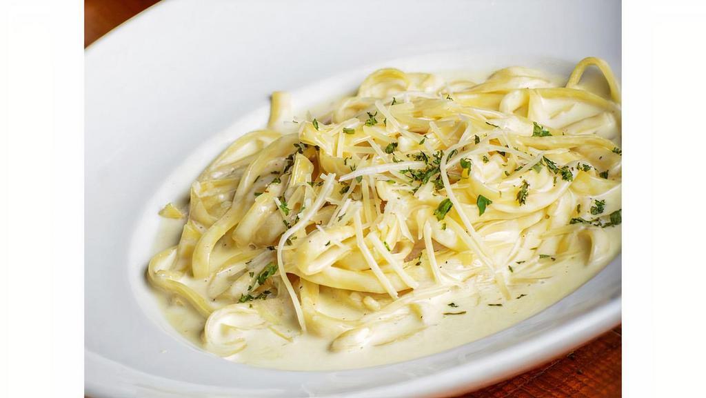Fettuccine Alfredo Large (With Chicken) · Fettuccine tossed with our homemade, rich and creamy Alfredo sauce topped with Parmesan.