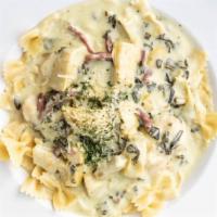 Chicken Mimosa Small (Serves 8-10) · Artichoke hearts and prosciutto sauteed with chicken in a spinach cream sauce; served with b...