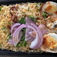 Chicken Biryani · basmati rice cooked with an aromatic blend of spices and served with raita and chutneys