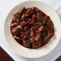 Beef Tibbs · Beef sautéed with onion, jalapeno, tomato and garlic. Served with 2 injeras.