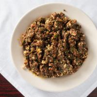 Special Kitfo · Minced spiced beef made with clarified butter served with 2 injeras and ayb (homemade soft c...