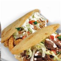 Combo #66 (2) Gorditas · Two thick handmade tortilla filled with refried beans, with meat choice, onions cilantro, sa...