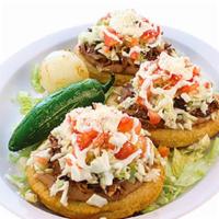 Combo #69 (3) Sopitos · Two thick handmade tortilla laid on lettuce, filled with refried beans, with meat choice, on...
