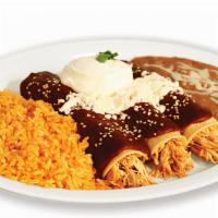 Enchiladas De Mole (3) · Spicy! Covered with mole sauce, Mexican cheese, sesame seeds and sour cream.