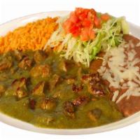 Pork On Chile Verde · Pork cubed cooked in a tomatillo salsa verde. Served with rice, beans and handmade tortillas.
