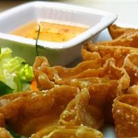 Crab Rangoons · Imitation crab meat mixed with cream cheese, wrapped in a wonton wrapper and deep fried. Ser...