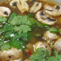 Tom Yum Soup · Spicy lemongrass soup flavored with galangal and lime leaves, with chopped white mushrooms. ...