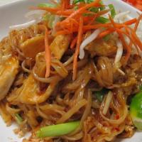 Phad Thai · Thin rice noodles stir-fried with eggs, green onions, bean sprouts and topped with ground pe...