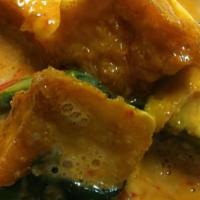 Pumpkin Curry · Simmered kabocha pumpkin in red curry with fresh bell peppers and basil leaves, with your ch...