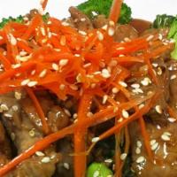 Broccoli With Oyster Sauce · Choice of meat sautéed in oyster sauce, garnished with sesame seeds on top and served on a b...