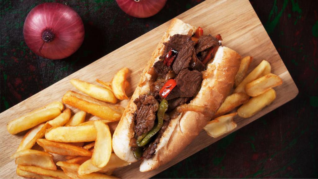 Philly Brisket Sandwich · Tender beef brisket with fresh bell peppers, onions and BBQ sauce. Presented in a delicious sandwich.