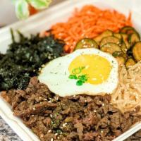 Bibimbap · Korean rice bowl topped with vegetables, bulgogi, and one fried egg. Comes with a side of go...