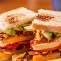 The Garth Breakfast Sandwich · Excellent... A triple-decker (3 slices of bread) breakfast sandwich on sourdough with fluffy...