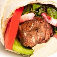 Tenderloin (Awsal) · Char-grilled angus beef tenderloin cubes with hummus, onion, parsley, sumac, pickles, and to...