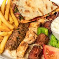 Mixed Grill · Char-grilled tenderloin 4 pcs, chicken tawook 4 pcs, kebab 1 skewer. Served with vegetables,...