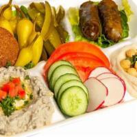 Vegan Platter · Vegan. Falafel 2 pcs, dolma 2 pcs, hummus, Baba ghanoush, vegetables, pickles, and pita bread.