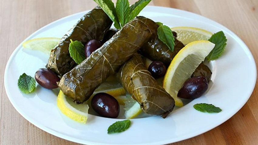 A6 Dolma (4Pcs) · Homemade. Grape leaves with rice and vegetables.