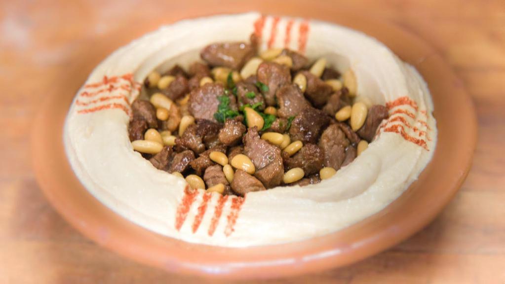 Hummus & Beef · Hummus topped with diced beef tenderloin. Served with pita bread and assorted vegetables.