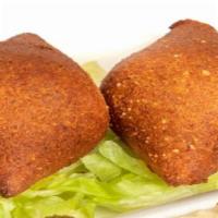 Kibbeh (3Pcs) · Ground beef and bulgur wheat patty stuffed with minced beef, onions, and pine nuts.