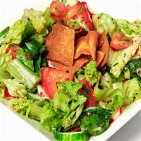 S2 Green Salad (Fattoush) · Vegan. Lettuce, tomatoes, cucumber, onions, parsley, mint, radish, green pepper, lemon, and ...
