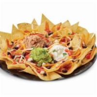 Nacho Grande · Original, seasoned beef or chicken; homemade corn tortilla chips smothered with refried pint...