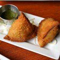 Punjabi Samosa [V] · A house favorite. Crisp pastry with mashed potatoes & peas, deep fried.