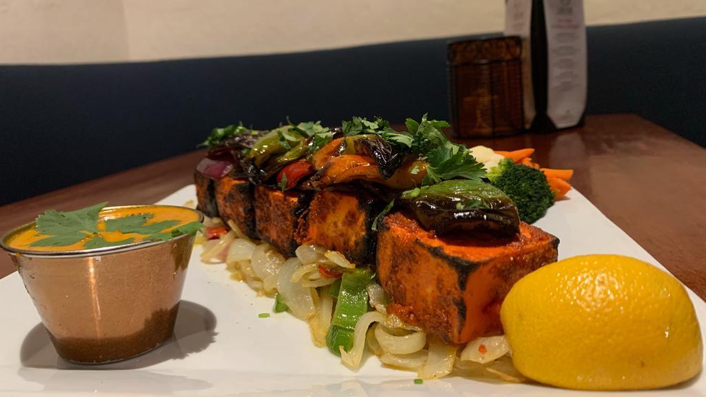 Paneer Shashlik · Marinated paneer cubes served with masala sauce and steamed vegetables (Broccoli, cauliflower, carrots and zucchini)