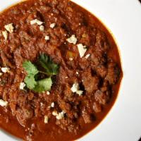 Lamb Rogan Josh [Gf] · Lamb cooked with gravy based on browned onions, yogurt, garlic, ginger and other spices.