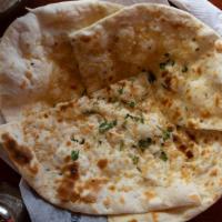 Garlic Naan · A house favorite. Naan with a subtle touch of garlic.