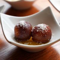 Gulab Jamun · A house favorite. A classic Indian dessert made of milk balls in sweet warm syrup.