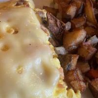 The Peppersauce Omelette · Farm fresh eggs loaded with a center of cream cheese, bacon, ham, peppers, onions and tomato...