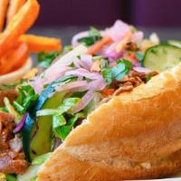 Spicy Beef Bánh Mì · Thinly shaved spicy beef, fresh & crisp Asian salad, bright, sweet, Vietnamese sauce, all pi...