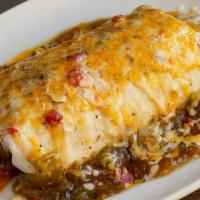 Breakfast Burrito · Really big. Eggs, cheddar, papitas, spicy pintos, homemade red or green, onion, and tomatoes...