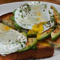 Avo Toast · Basted, cage free eggs, fresh avocado slices, Romano on buttered, grilled brioche.