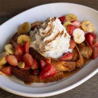 Fabulous French Toast · Thick cut brioche, fresh strawberries & bananas, caramelized brown sugar butter sauce, lots ...