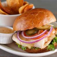 Grilled Or Crispy Chicken Sandwich · All natural, cage free chicken breast & homemade pickles, lettuce, tomato & onion on our bak...