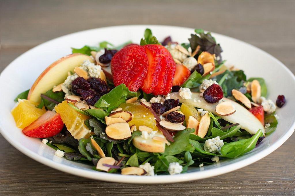 Crave · Bleu cheese, almonds, organic greens, strawberries, oranges, apples, cranberries, tomatillo lime vinaigrette.  . *For Gluten-Not orders, be sure to order without a dinner roll..