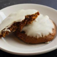 Pumpkin Spice Cookie · A soft, cakey pumpkin cookie filled with walnuts and raisins, and topped with vanilla frosti...