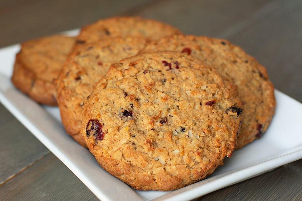 Cowgirl Cookie · Our famous Cowgirl Cookie, baked with coconut flakes, brown sugar, oats, apricots, raisins, cranberries, walnuts, honey, and cinnamon.