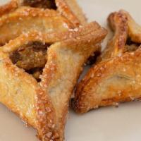 Hamantaschen Cookie · A sweet cookie pocket filled with dried apricots, golden sultana raisins, walnuts, and honey.
