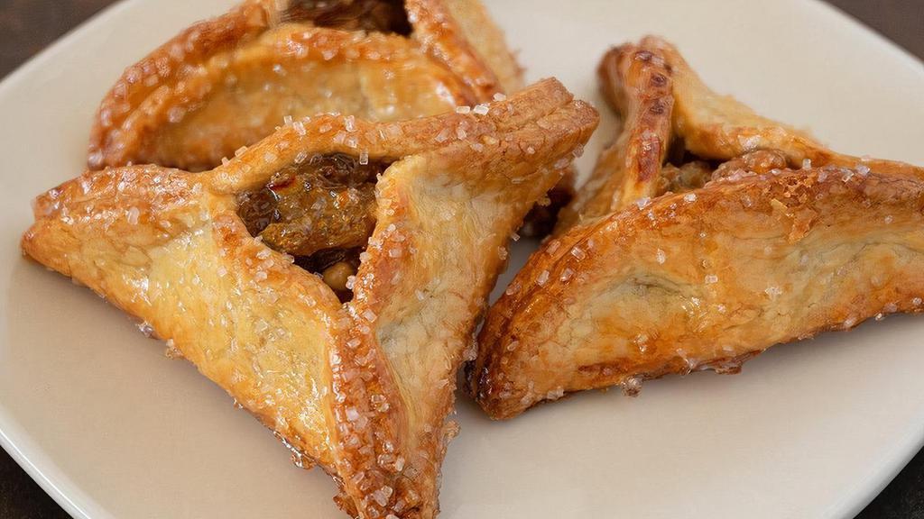Hamantaschen Cookie · A sweet cookie pocket filled with dried apricots, golden sultana raisins, walnuts, and honey.